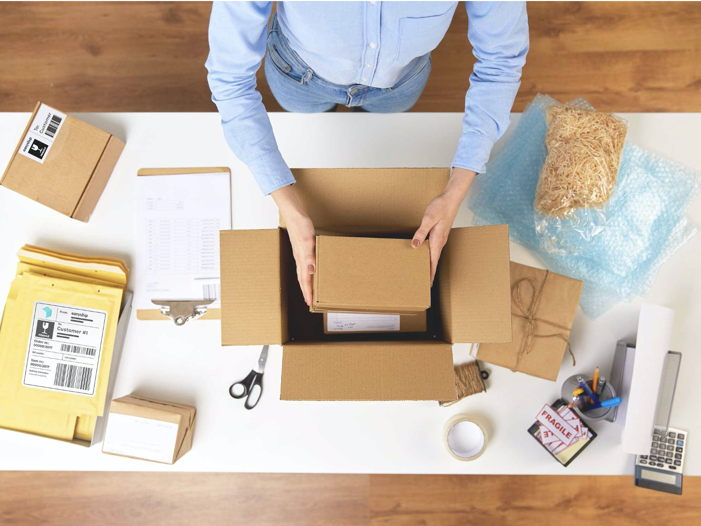 eCommerce merchant packaging a product