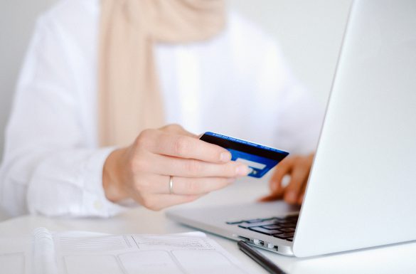 woman online shopping with credit card