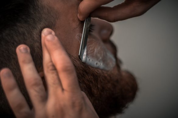 Man shaving beard