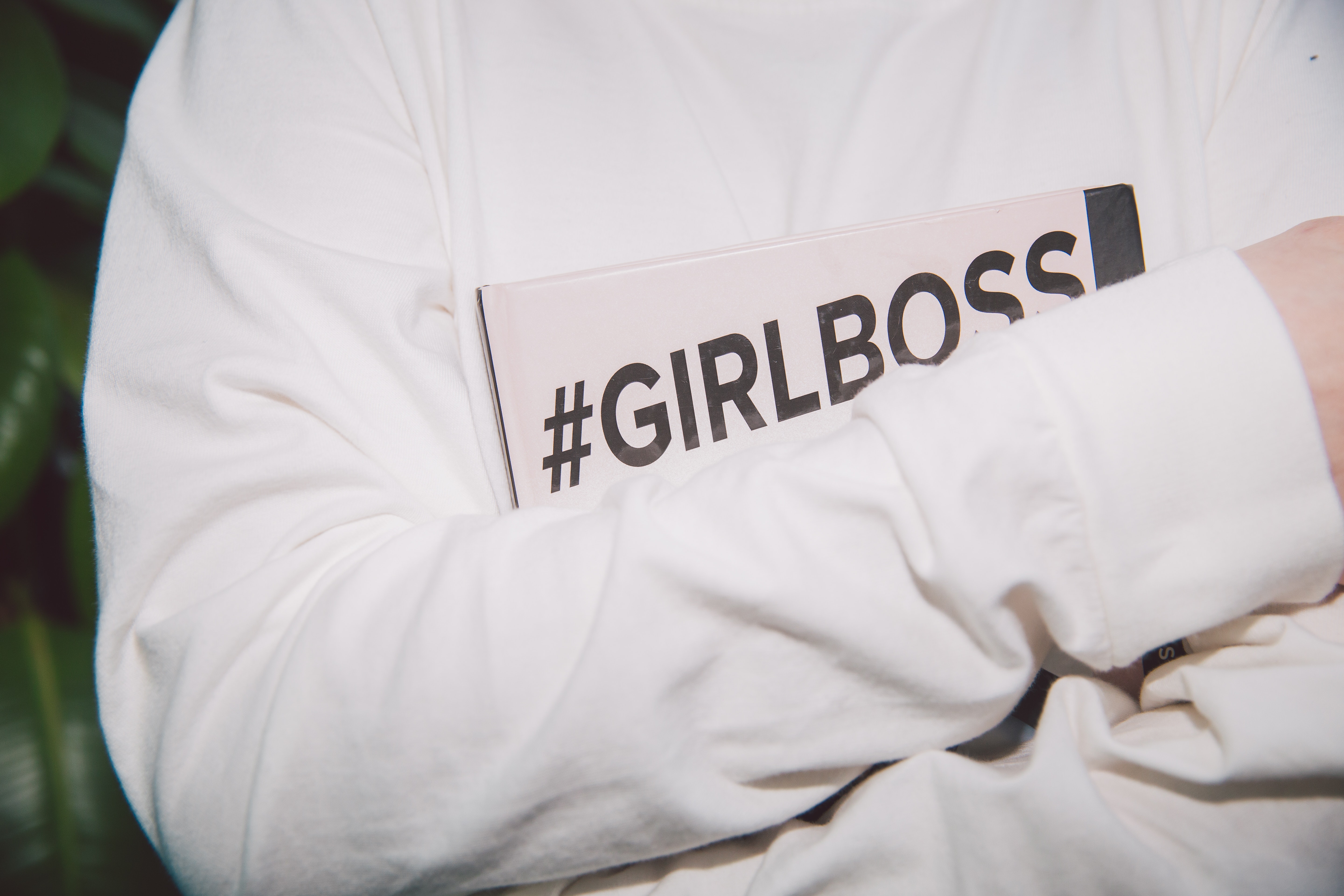 Person holding girlboss book