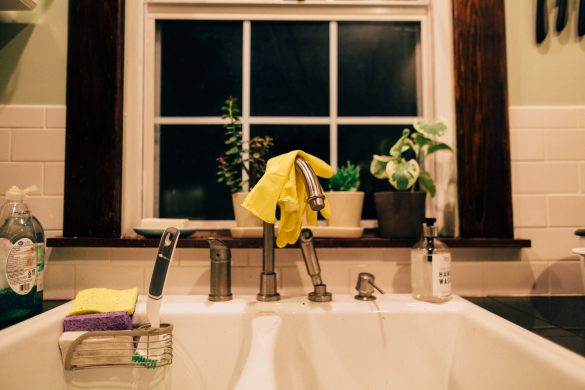 dishwashing gloves in the sink